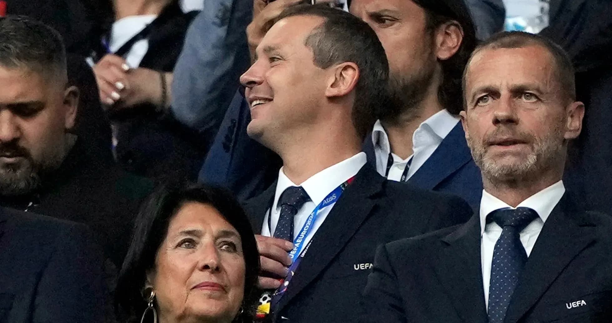 Officials watching a match from the stands