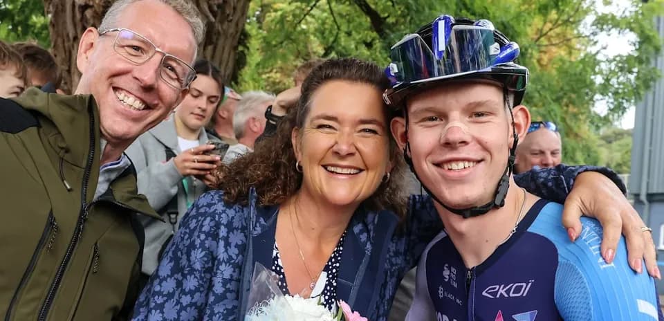 Three people posing together after cycling event