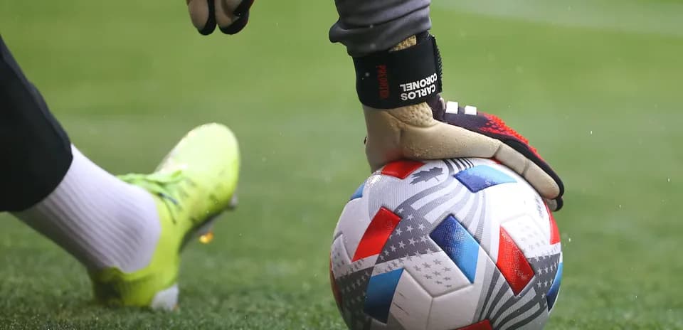 Goalkeeper placing ball on the field
