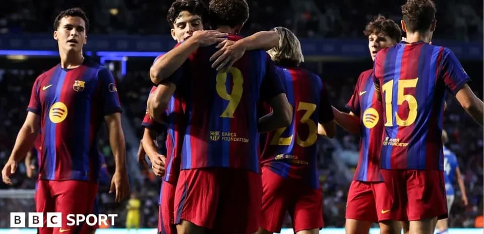 Barcelona players celebrating a goal on the pitch