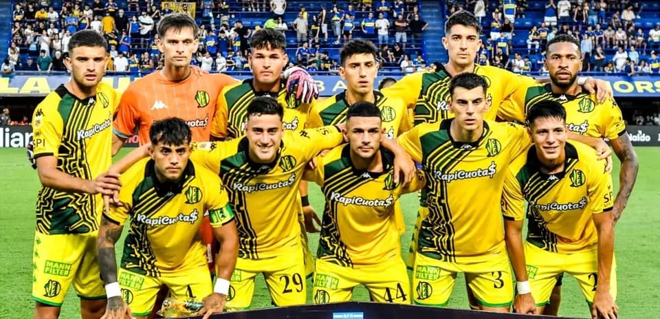 Football team posing for group photo before match