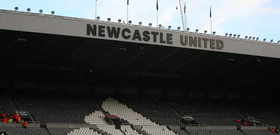 Newcastle United stadium seating area with signage