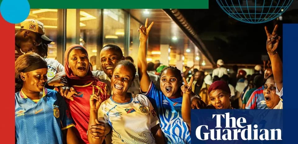 Football fans celebrating together with team jerseys