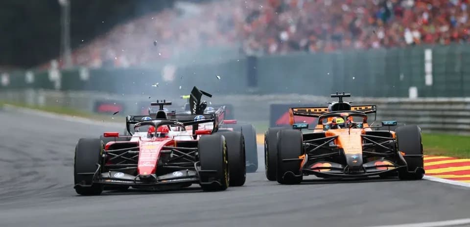 Ferrari and McLaren cars in a close race