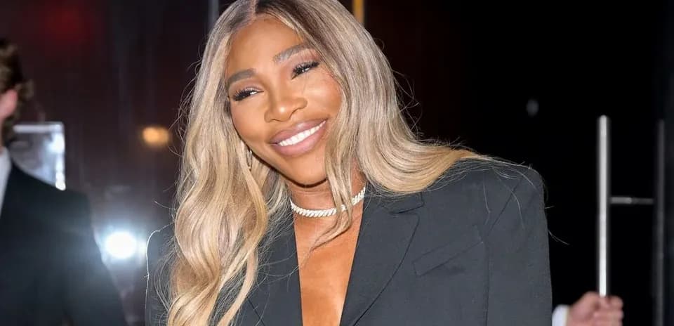 Serena Williams smiling in stylish outfit