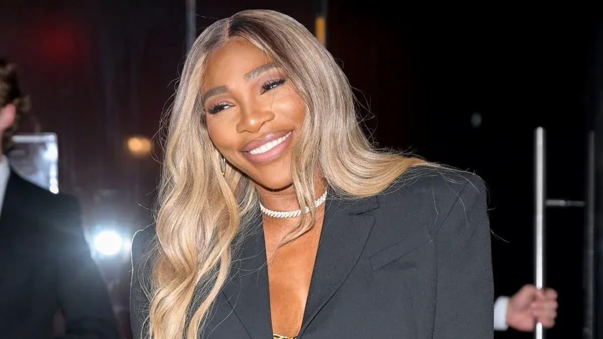 Serena Williams smiling in stylish outfit