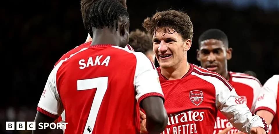 Arsenal players celebrating a goal together