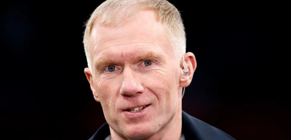 Shirted man with short hair and earpiece