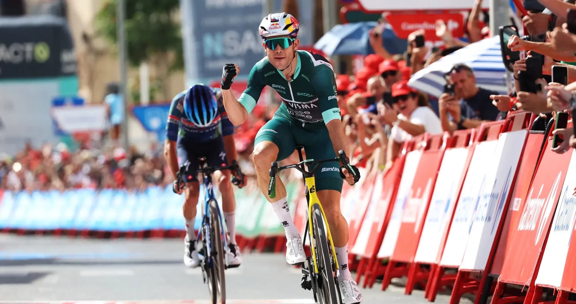 Cyclist celebrating victory at finish line