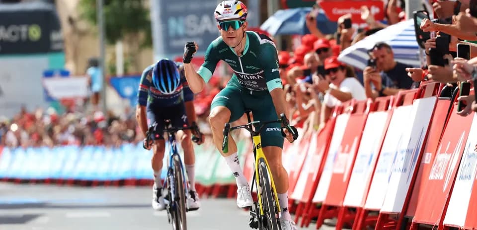 Cyclist celebrating victory at finish line