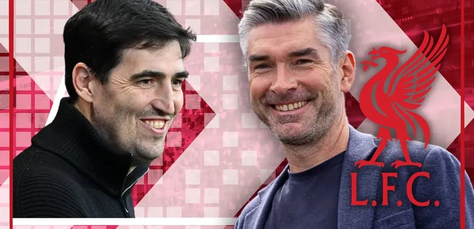 Two coaches smiling against Liverpool background