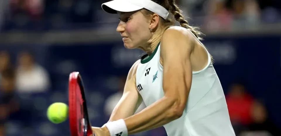 Tennis player striking the ball during a match