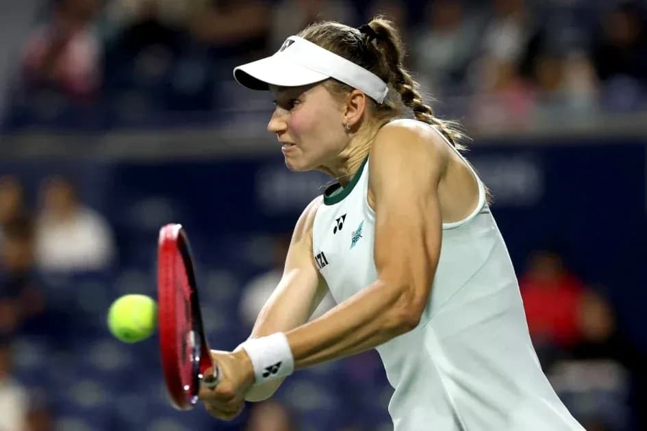 Tennis player striking the ball during a match
