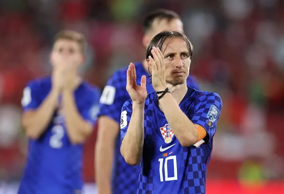 Luka Modric applauding fans after the match