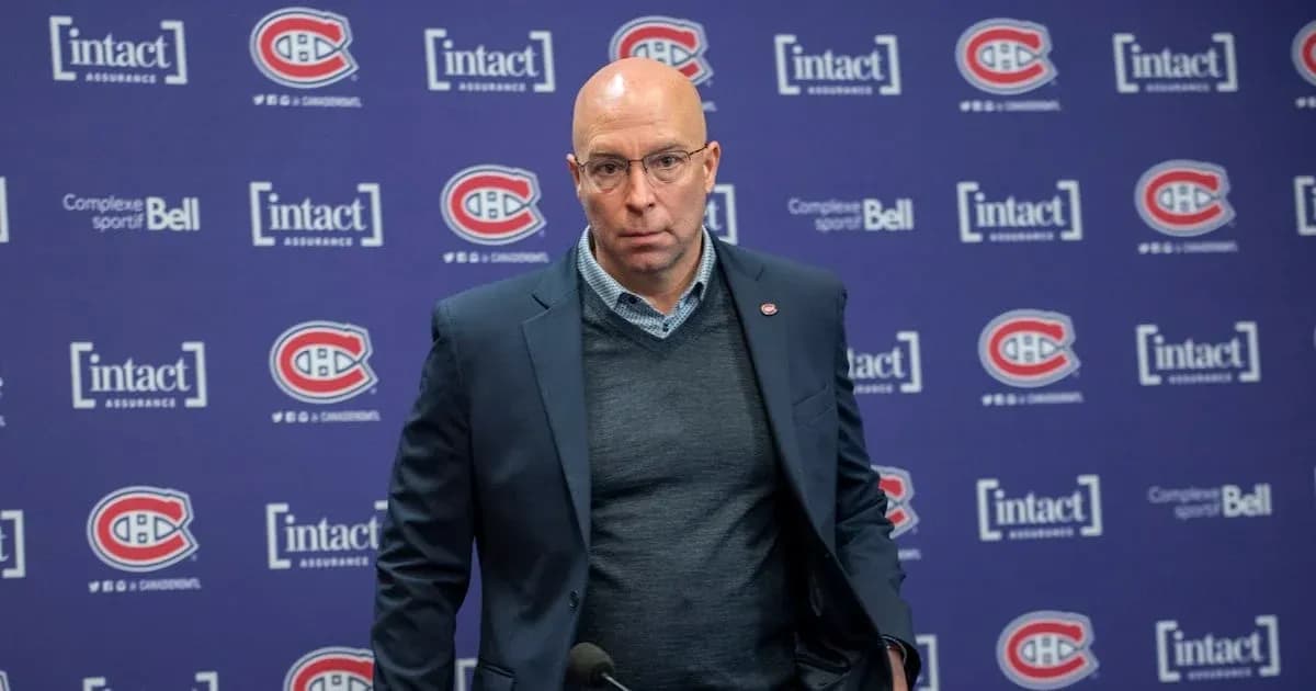 Man at podium during press conference with Canadiens branding