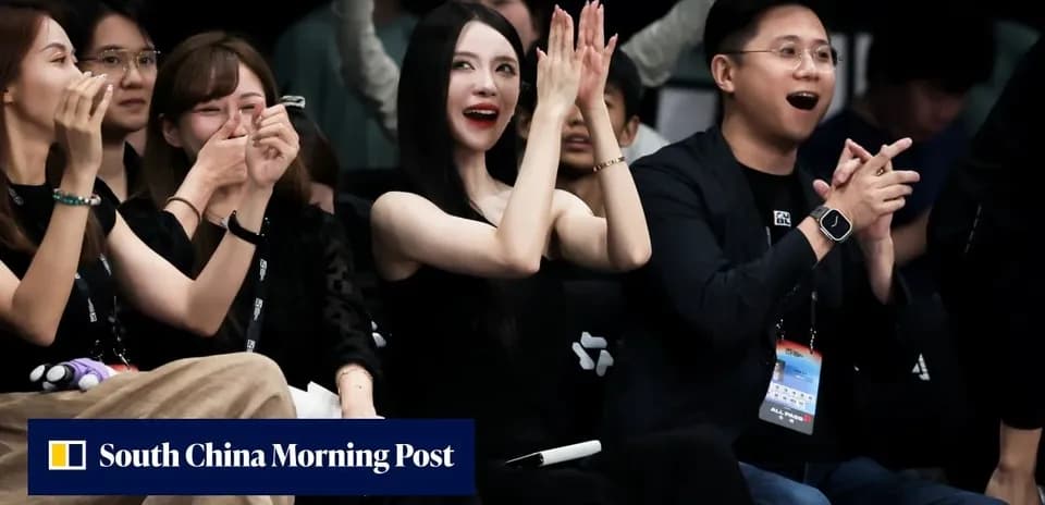 Audience members cheering at an event