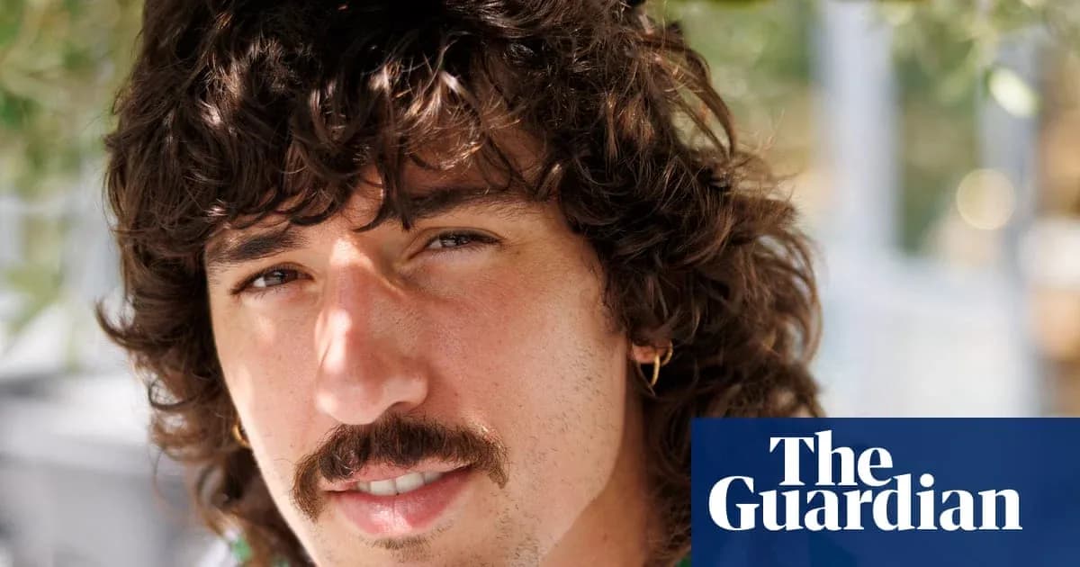 Yoshigiri with curly hair and mustache close-up