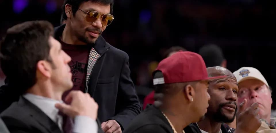 Manny Pacquiao talking with friends at an event