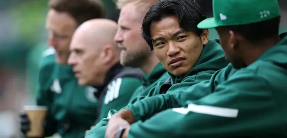 Players sitting on bench during a match
