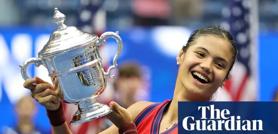 Tennis player holding US Open trophy in celebration