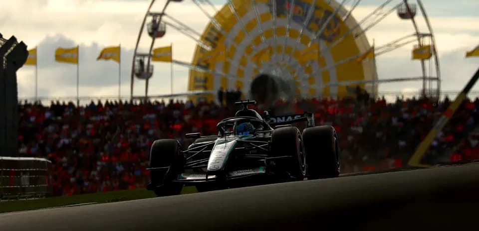 Formula 1 car racing with Ferris wheel in background
