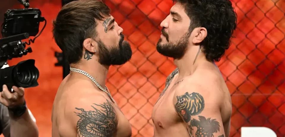 Two fighters facing off during weigh-in event