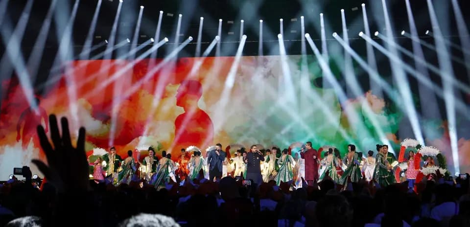 Performers on stage during colorful cultural event