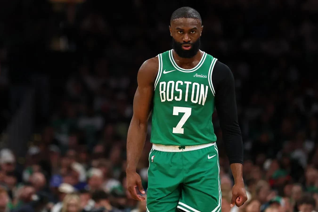 Basketball player in Boston Celtics uniform on court
