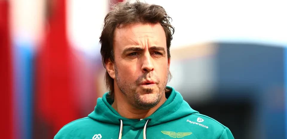 F1 driver in Aston Martin hoodie at event