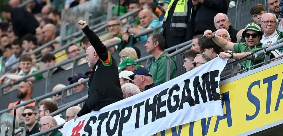 Fans holding a banner during a sports event