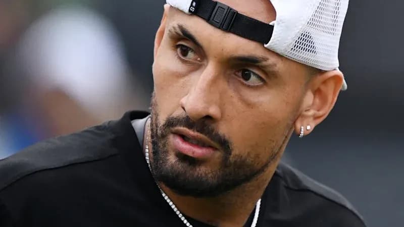Tennis player in practice session wearing cap