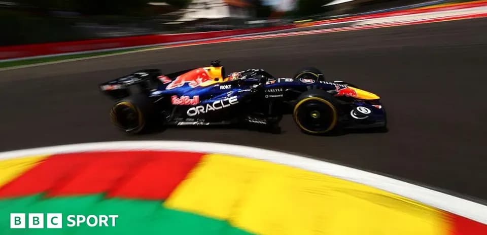 Formula 1 car racing around a colorful track