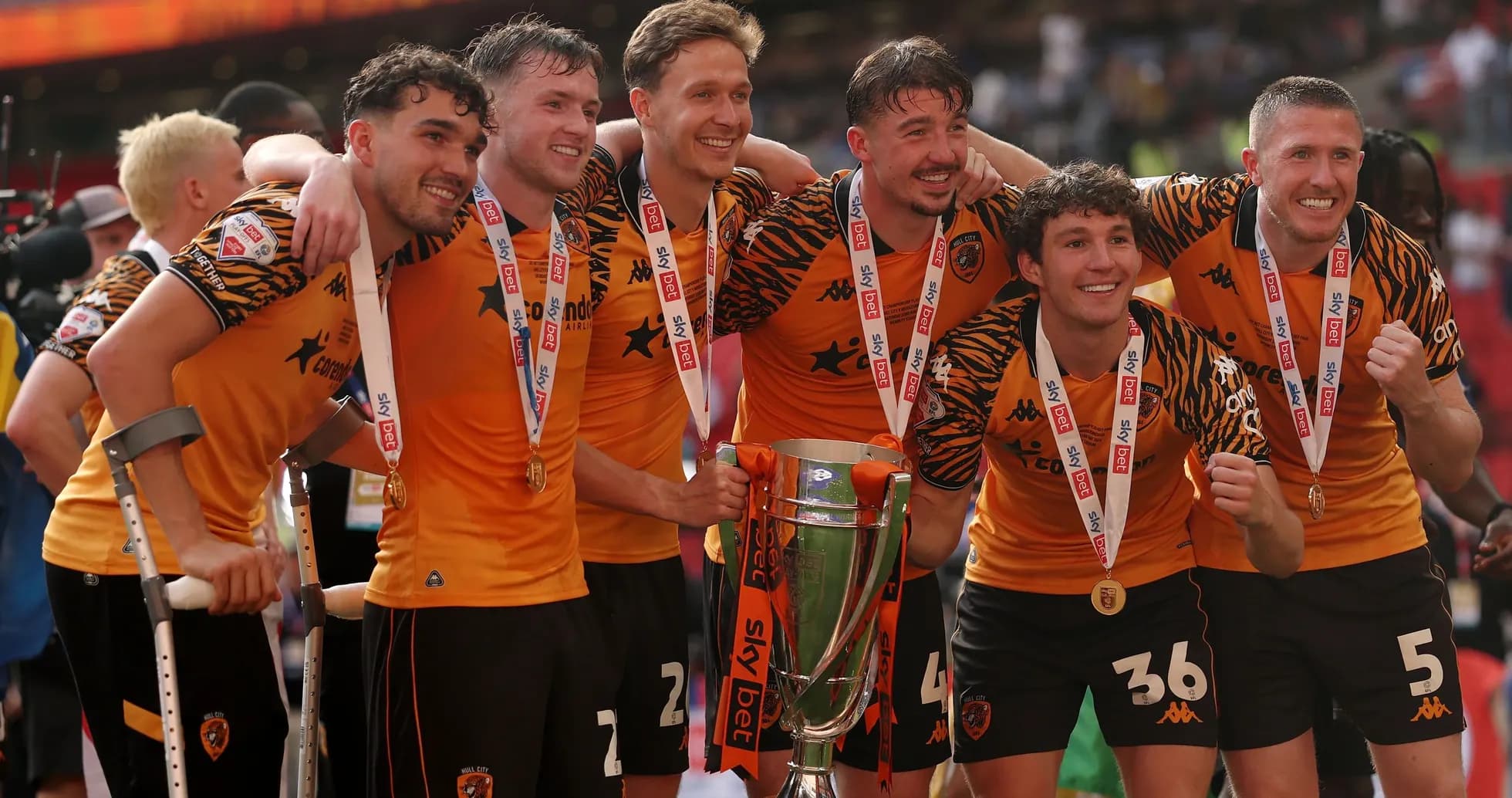 Hull City players celebrating with trophy after victory