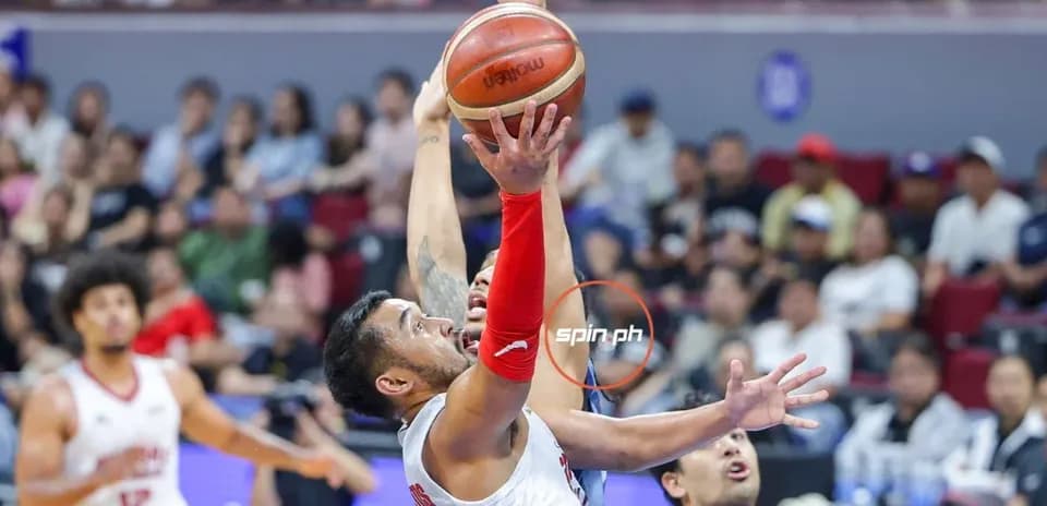 Player shooting basketball during a game