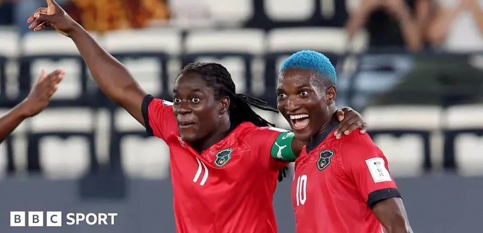 Two players celebrating after scoring a goal
