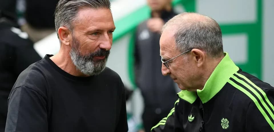 Two football coaches speaking before a match
