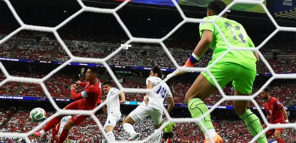 Goalkeeper diving to save a shot during match