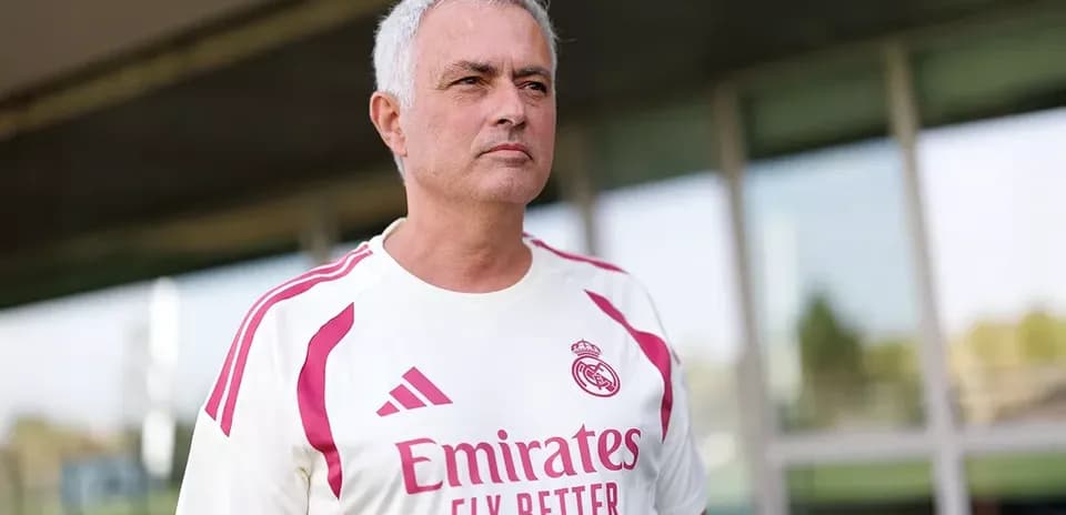 Mourinho wearing Real Madrid training kit outdoors