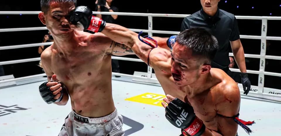 Two fighters exchanging punches in the ring