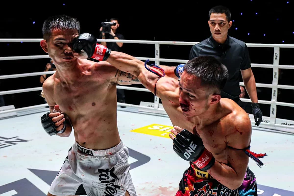 Two fighters exchanging punches in the ring