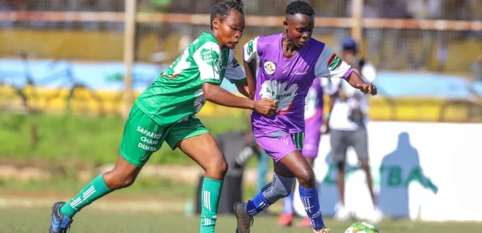 Two players competing for the ball during match