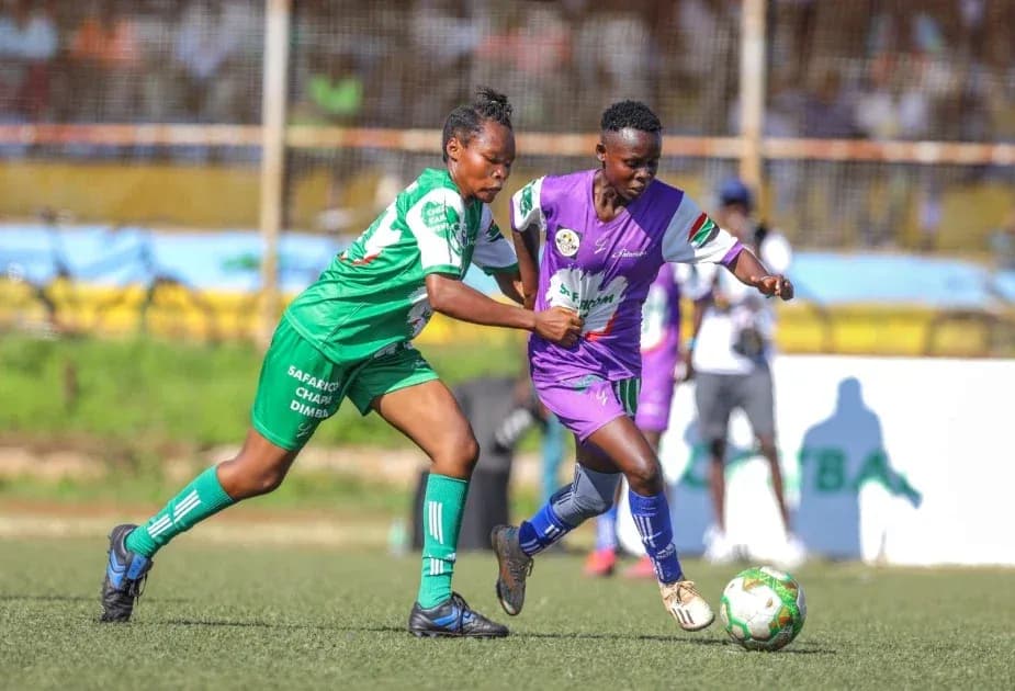 Two players competing for the ball during match