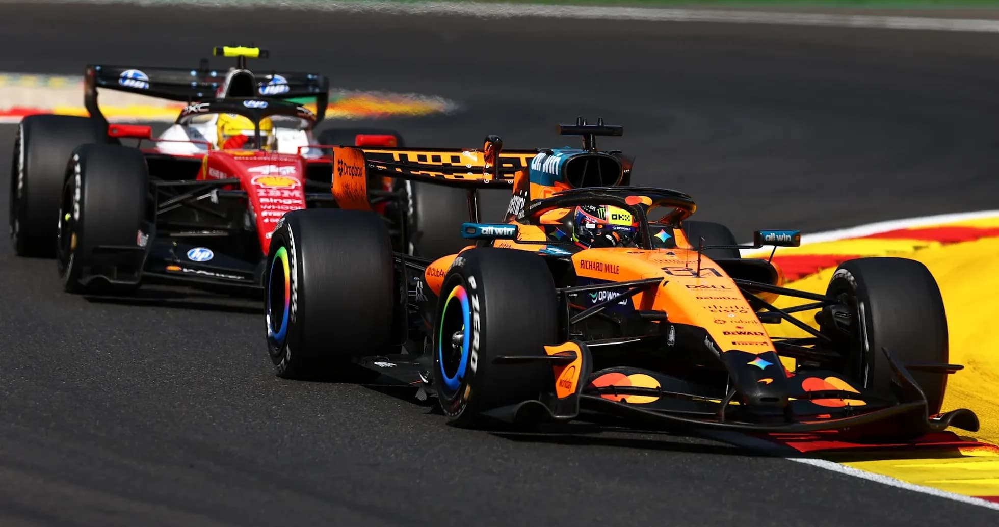McLaren and Ferrari racing on track during Grand Prix