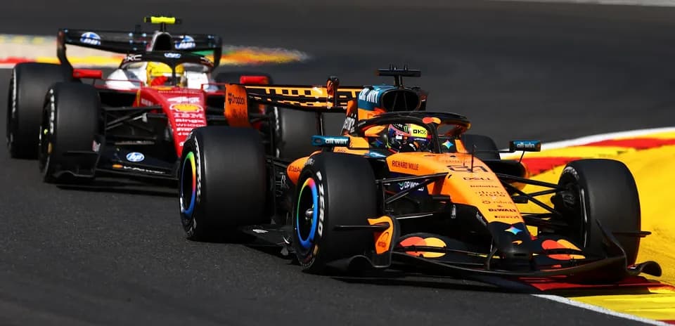 McLaren and Ferrari racing on track during Grand Prix