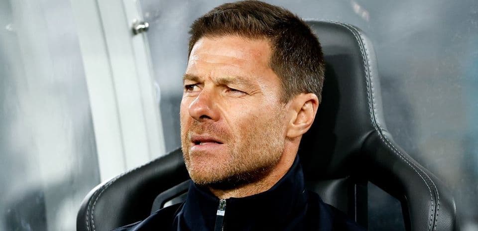 Coach sitting on bench during a match