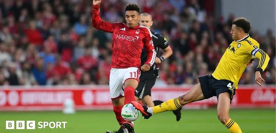 Two players contesting the ball during a match