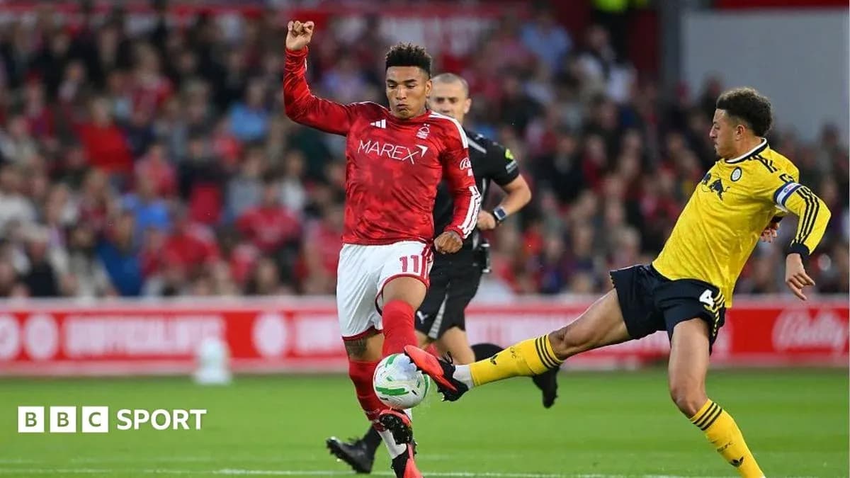 Two players contesting the ball during a match