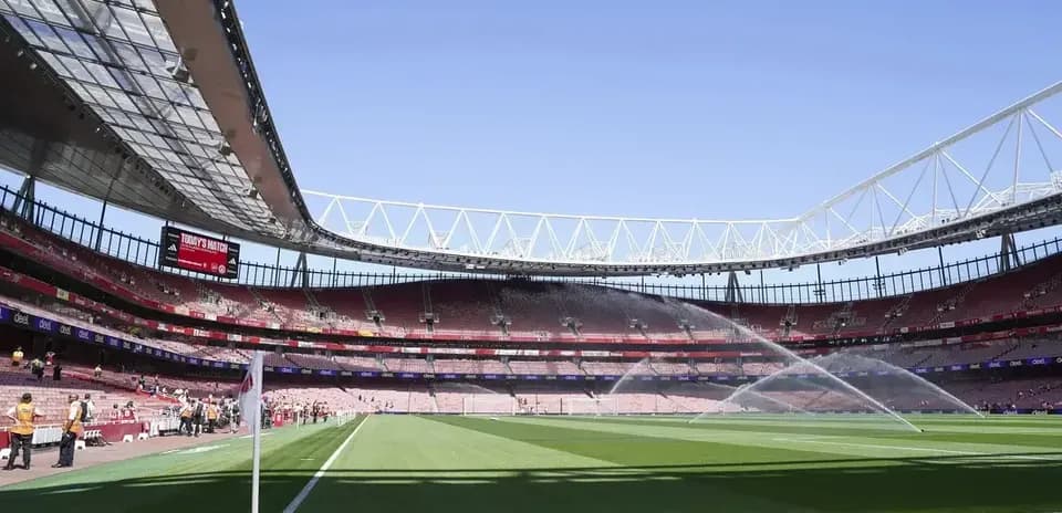 Emirates Stadium with sprinklers on the pitch