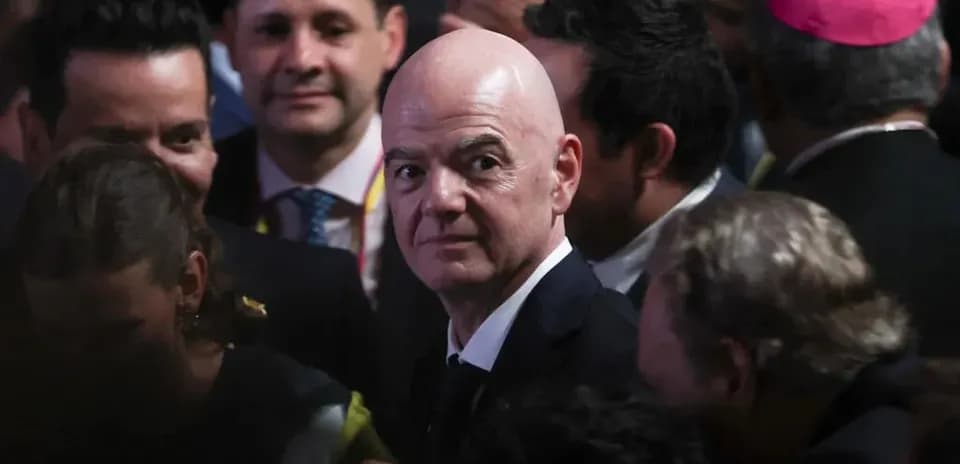 FIFA President in crowded event with attendees