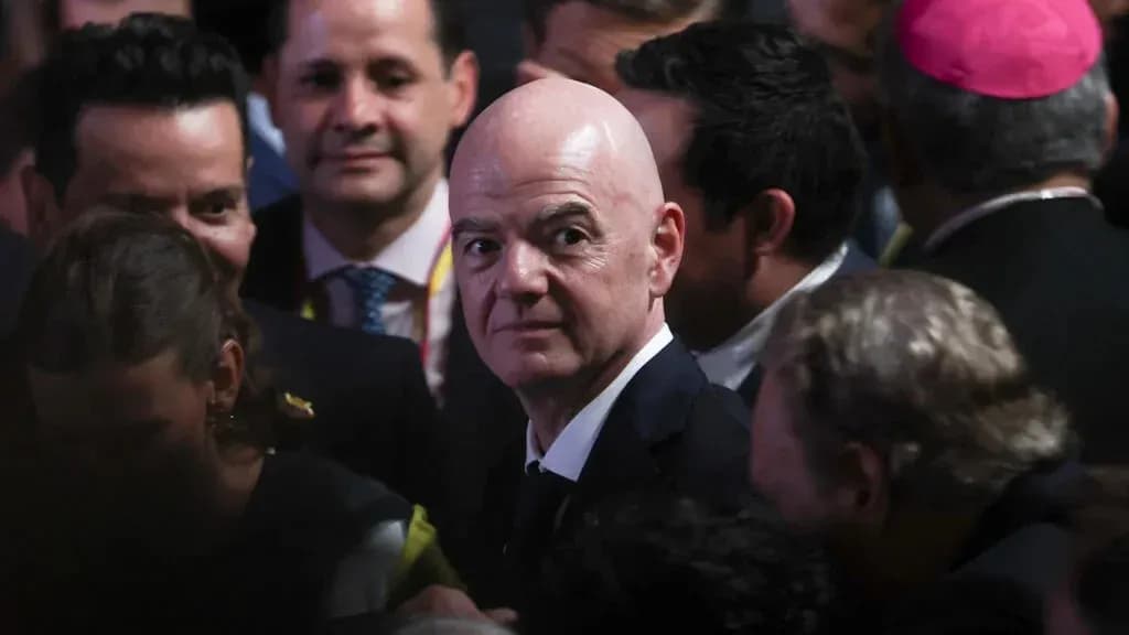 FIFA President in crowded event with attendees